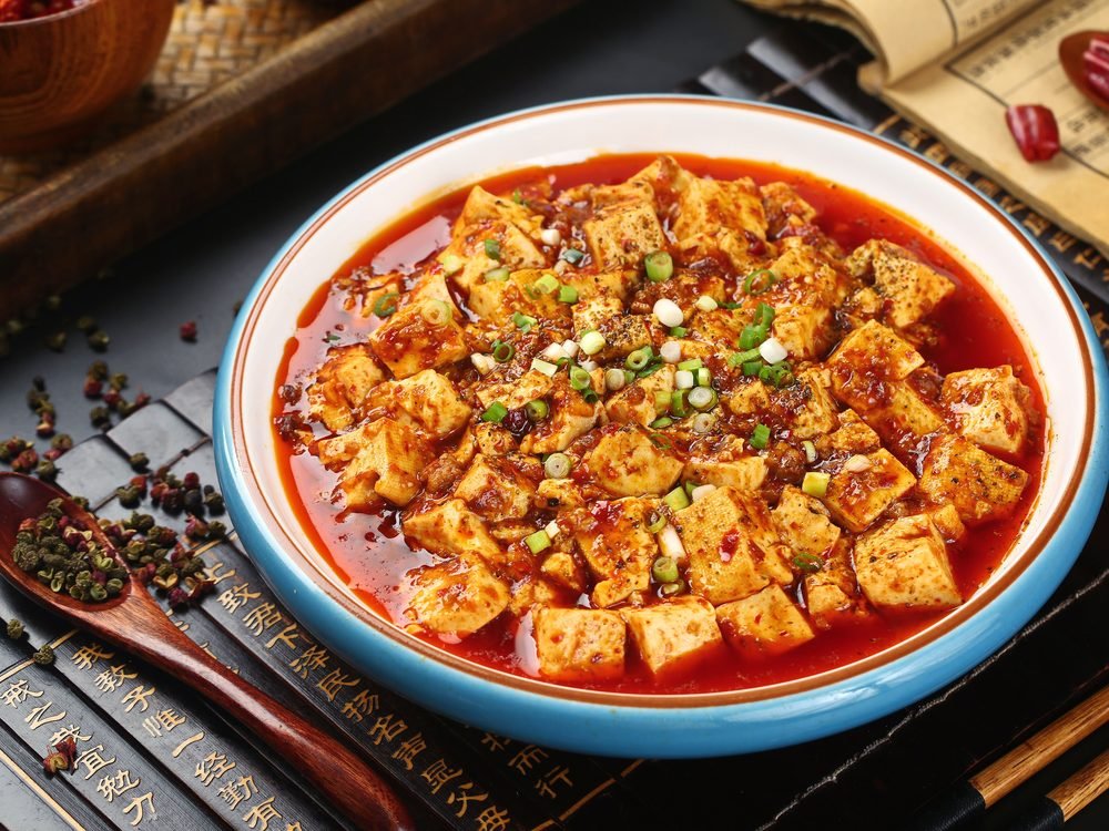 Mapo tofu in chili-bean sauce topped with scallions